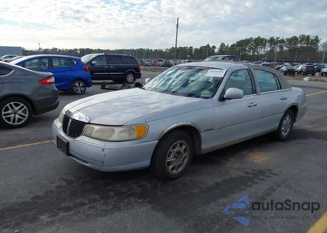 1998 Lincoln Town Car Signature из США, поврежденный, VIN 1LNFM82W3WY673210